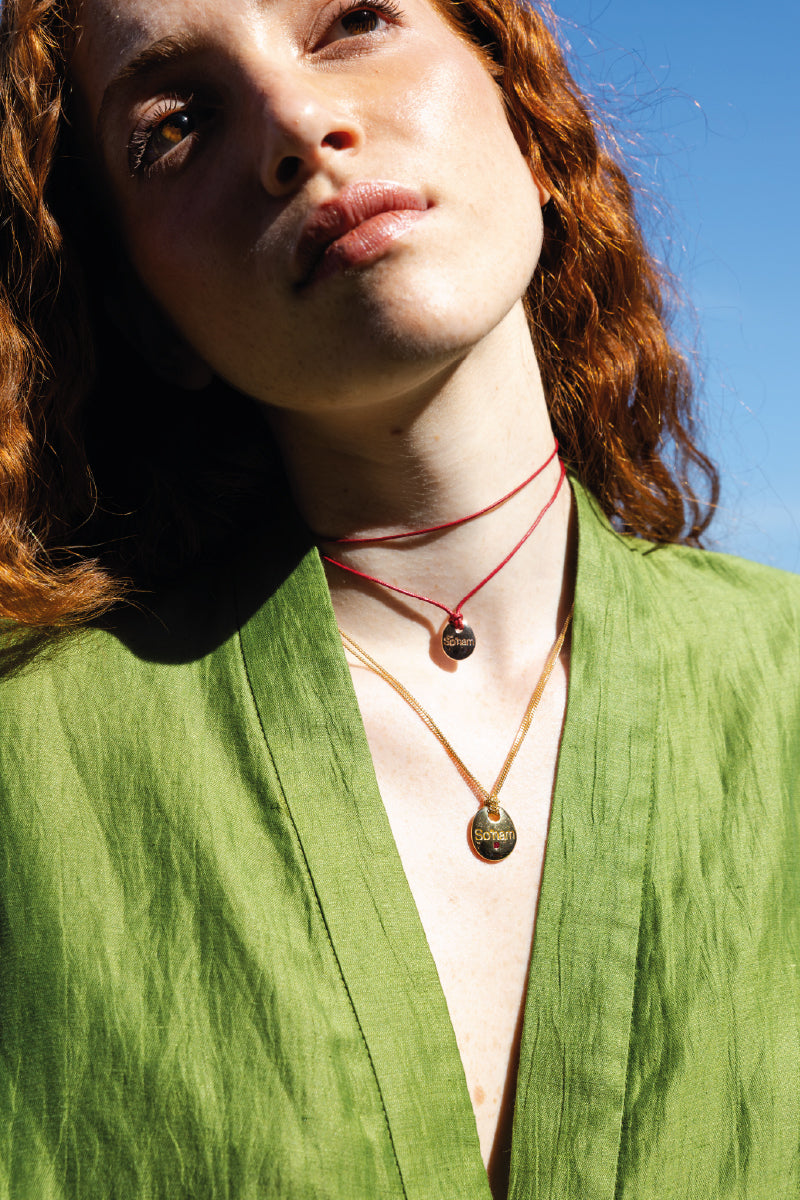 "So'ham Pendant — 18K Gold Plated 925 Sterling Silver on Waxed Cotton Cord"